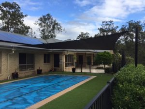 shade sail over pool total shade solutions brisbane queensland black posts replacement