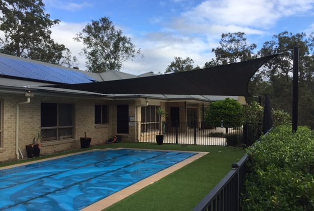 shade sail over pool total shade solutions brisbane queensland black posts replacement
