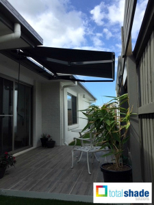 retractable awning over courtyard small area folding arm awning total shade solutions uv protection sun prevention overhead shade